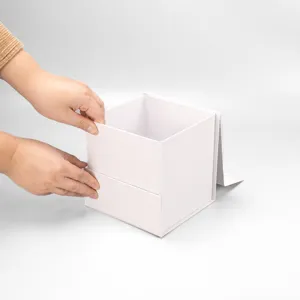 Detail shot of the white square folding gift box showing its sturdy cardboard construction.