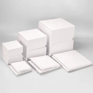 Detail view of white foldable gift boxes in various sizes, showing high quality packaging design.