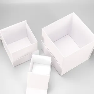 Set of three white folding gift boxes, square rigid box for packaging and retail use.