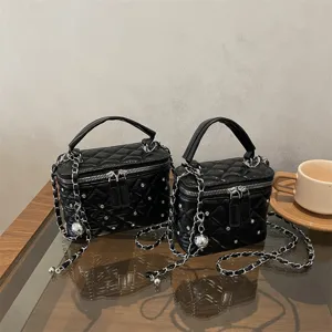 Black quilted chain crossbody bag for women, stylish diamond studded vanity handbag commuter.