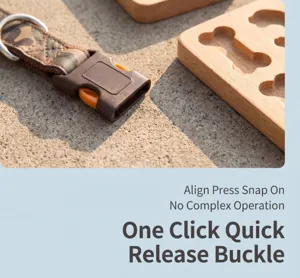 Detailed view of pet collar buckle with camouflage webbing and durable brown plastic quick-release.