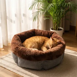 Cozy round plush pet bed with soft brown faux fur rim and grey corduroy side for cats and dogs.