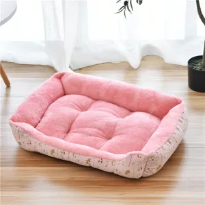 Cozy pink plush pet bed with raised rim, soft cushion for small dogs and cats, warm and comfortable.