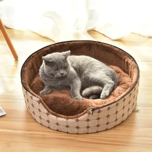 Cozy round pet bed for cats and small dogs, soft plush interior with removable cover.