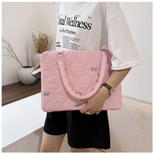Korean style quilted pink laptop bag with cute blue bow embroidery for daily commuting.