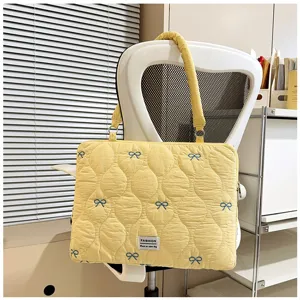 Korean style quilted laptop bag with cute blue embroidered bows, elegant yellow shoulder handbag.