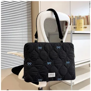 Korean style quilted laptop bag with cute blue bow embroidery, stylish black shoulder bag.