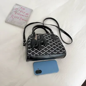 Fashion black and white chevron pattern commuter handbag, elegant crossbody shoulder bag for women.