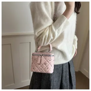 Pink quilted chain crossbody bag for women, stylish small square bag with studded details.