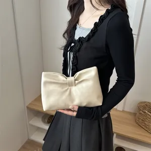 Elegant beige bow clutch bag, chic minimalist design for daily commute and stylish events.