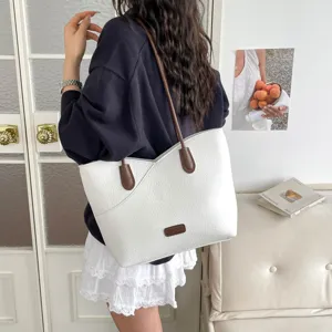Women's white tote bag with brown straps, contrast color PU leather shoulder bag for daily commuting.