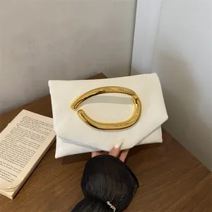 Elegant white leather clutch bag for women, chic gold metal handle evening handbag, stylish.