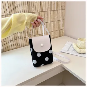 Chic black and white polka dot crossbody phone bag with chic flap and strap detail.