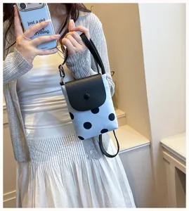 Detailed view of the stylish polka dot shoulder phone bag, perfect for daily casual wear.