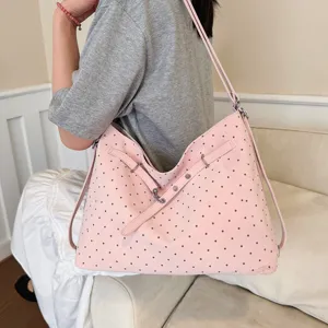 Pink polka dot shoulder bag detail, soft casual tote bag for women daily commuting.