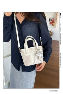 Summer stylish minimalist bucket bag, high-end design, versatile crossbody shoulder handbag.