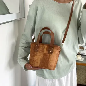 Classic brown pattern tote bucket bag, stylish crossbody design with dual handles for daily wear.
