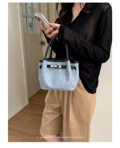Retro denim handbag for women, chic bucket bag with metal lock and top handle, casual daily bag.