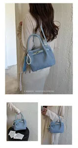 Retro denim handbag with metal lock and pearl strap, casual shoulder crossbody bag for women.