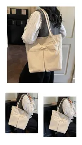Primo piano della borsa tote casual in tela con tasche anteriori e grande capienza.