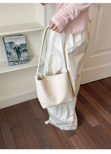 Elegant woven shoulder bag for women, stylish minimalist retro underarm handbag for summer daily wear.