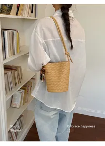 Korean vintage woven bucket bag for women, stylish single shoulder messenger bag with bead decor.