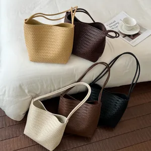 Woven shoulder bag detail view showing fine leather texture, elegant daily casual style.