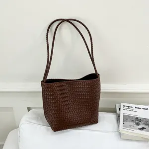 Vintage brown woven leather shoulder bag, chic minimalist style casual underarm tote bag for women.