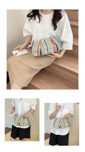 Casual colorful woven straw clutch bag, stylish beach handbag featuring unique striped design.