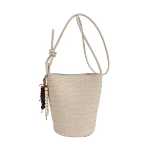Woven leather bucket bag for women, stylish retro crossbody shoulder bag with bead charm.