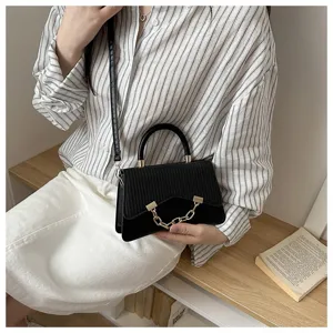 Stylish black small square handbag for women, chic crossbody shoulder bag with chain detail.