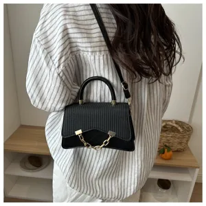 Stylish black cross-body shoulder handbag featuring chic golden chain detail for women daily wear.