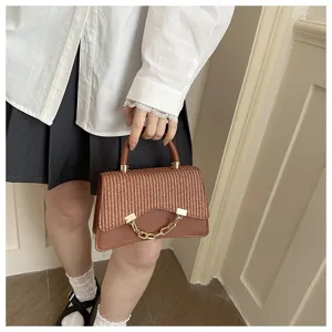 Chic woven top handle handbag with metal chain detail, stylish brown shoulder crossbody bag.