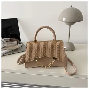 Chic straw woven and leather patchwork shoulder bag for women, elegant top handle crossbody handbag.