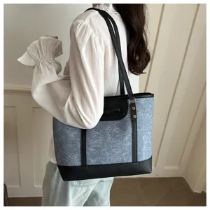 Stylish women's tote bag with bow detail, large capacity shoulder bag for daily commute.