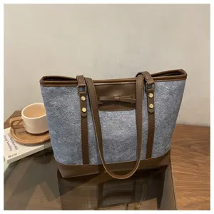 Women gray felt tote bag with brown leather trim, stylish daily shoulder bag for commute.