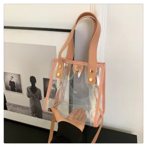 Διαφανής τσάντα PVC jelly με ροζ τελείωμα και χρυσά μεταλλικά στοιχεία, κομψή τσάντα ώμου.