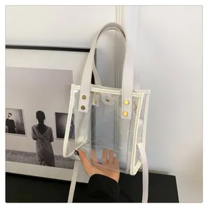Διαφανής τσάντα PVC jelly με λευκή δερμάτινη λεπτομέρεια και λουρί ώμου για καθημερινή χρήση.