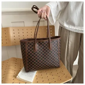 Stylish large capacity M letter print shoulder tote bag for commuting and daily use.