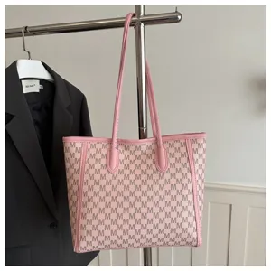 Large capacity monogram tote bag with pink leather trim and dual shoulder straps for daily work commute.
