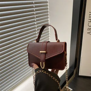 Korean style brown mini shoulder bag for women, chic commuter crossbody bag with chain strap.