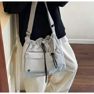 Casual nylon drawstring shoulder bag, trendy slouchy crossbody tote for autumn and winter.