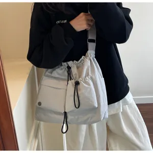 Casual lightweight drawstring shoulder bag, minimalist multipocket crossbody for daily.