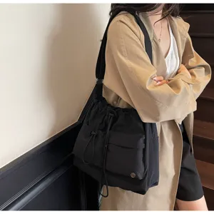 Minimalist drawstring shoulder bag, casual messenger tote bag with multiple front pockets for women.