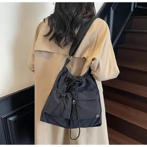 Black drawstring shoulder bag casual crossbody tote bag detail view for women's autumn style