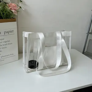 Borsa tote trasparente in gelatina con manici bianchi, borsa a spalla casual per lo street style.