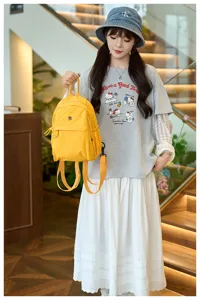 Stylish lightweight women nylon backpack, casual bright yellow daypack for daily travel.