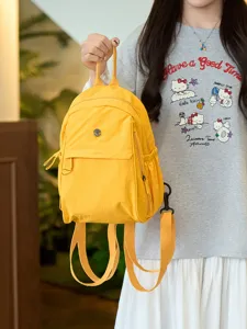 Casual nylon backpack for women, lightweight and durable yellow daily daypack detail view.