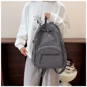 Casual solid color nylon backpack for women, multi-pocket design, large capacity bag.
