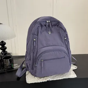 Stylish solid color casual backpack for women, large capacity daily travel school book bag.